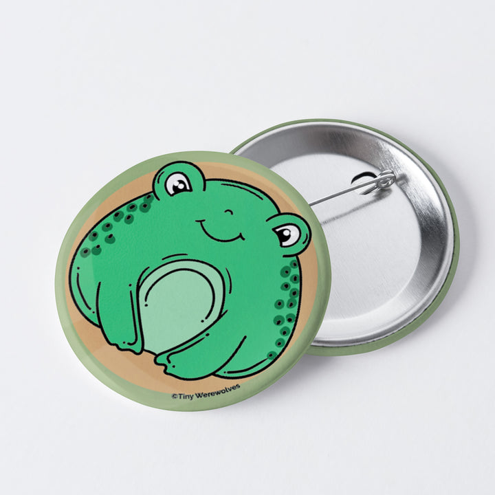 Based in Chicago by queer artist & designer Kayla Pekkala - Tiny Werewolves | Frog 1" Mini Button Pin in | Shop to get your Metal Pinback Button with collections featuring retro-inspired designs infused with social commentary art, highlighting modern social & current events.