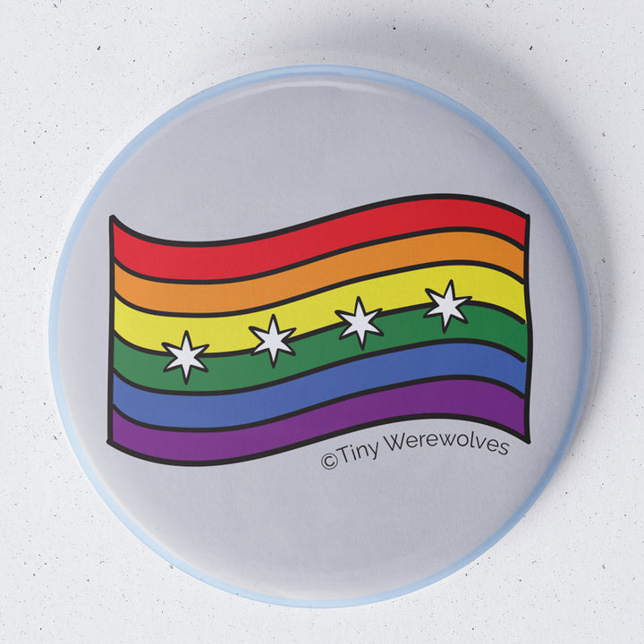 Based in Chicago by queer artist & designer Kayla Pekkala - Tiny Werewolves | Chicago Rainbow Pride Flag 1.75" Button Pin in | Shop to get your Metal Pinback Button with collections featuring retro-inspired designs infused with social commentary art, highlighting modern social & current events.