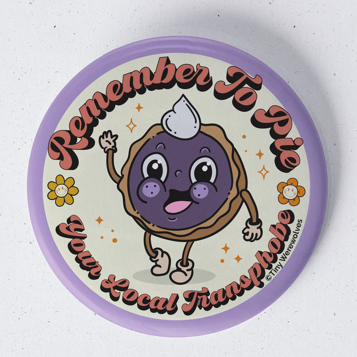 Based in Chicago by queer artist & designer Kayla Pekkala - Tiny Werewolves | Pie Your Local Transphobe 1.75" Button Pin in | Shop to get your Metal Pinback Button with collections featuring retro-inspired designs infused with social commentary art, highlighting modern social & current events.