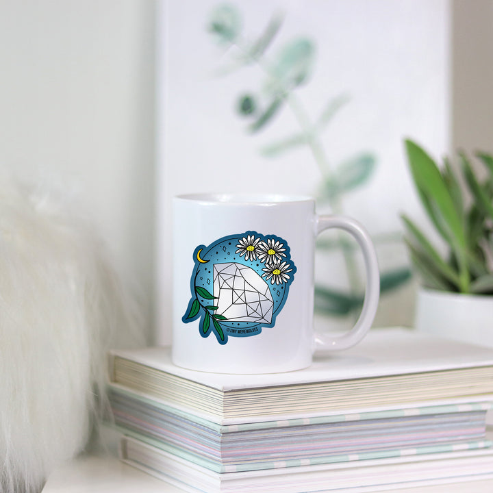 Based in Chicago by queer artist & designer Kayla Pekkala - Tiny Werewolves | April Crystal & Flower Birthstone Mug in | Shop to get your Mug with collections featuring retro-inspired designs infused with social commentary art, highlighting modern social & current events.