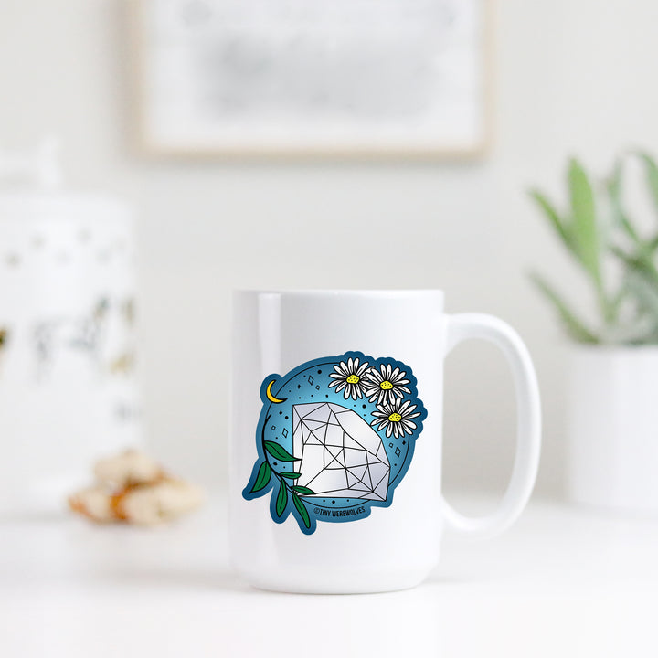 Based in Chicago by queer artist & designer Kayla Pekkala - Tiny Werewolves | April Crystal & Flower Birthstone Mug in | Shop to get your Mug with collections featuring retro-inspired designs infused with social commentary art, highlighting modern social & current events.