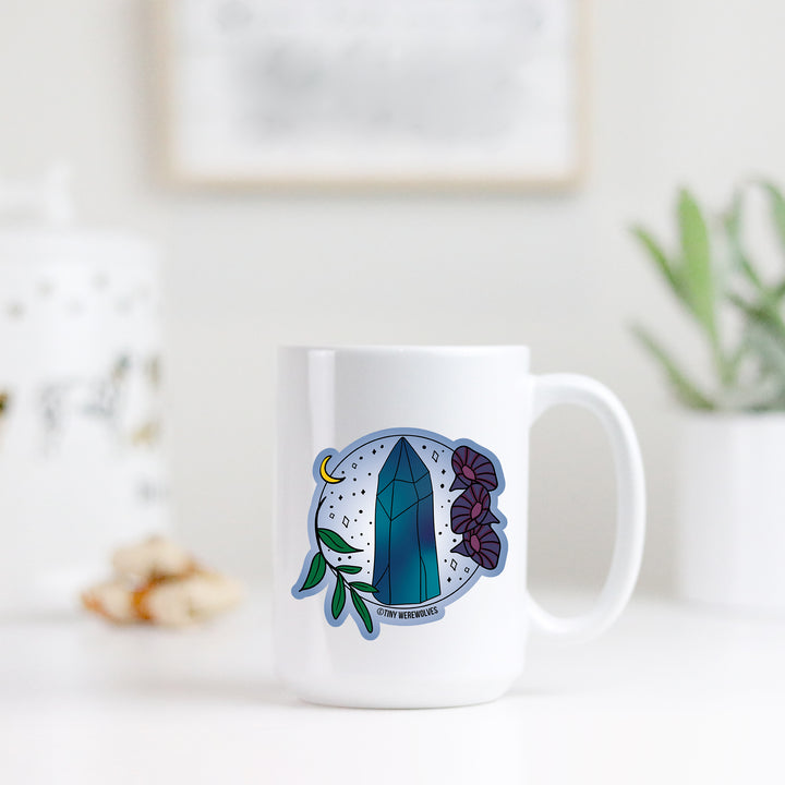 Based in Chicago by queer artist & designer Kayla Pekkala - Tiny Werewolves | September Crystal & Flower Birthstone Mug in | Shop to get your Mug with collections featuring retro-inspired designs infused with social commentary art, highlighting modern social & current events.