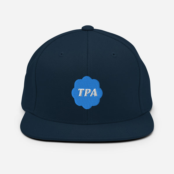 Based in Chicago by queer artist & designer Kayla Pekkala - Tiny Werewolves | TPA Verified Embroidered Snapback in Dark Navy | Shop to get your Snapback with collections featuring retro-inspired designs infused with social commentary art, highlighting modern social & current events.